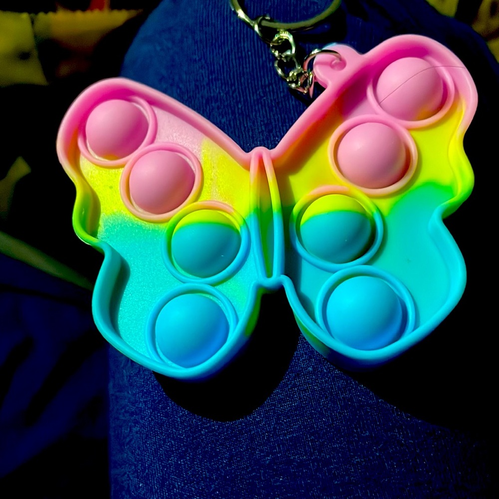 It is a mini pop it and it is a butterfly
